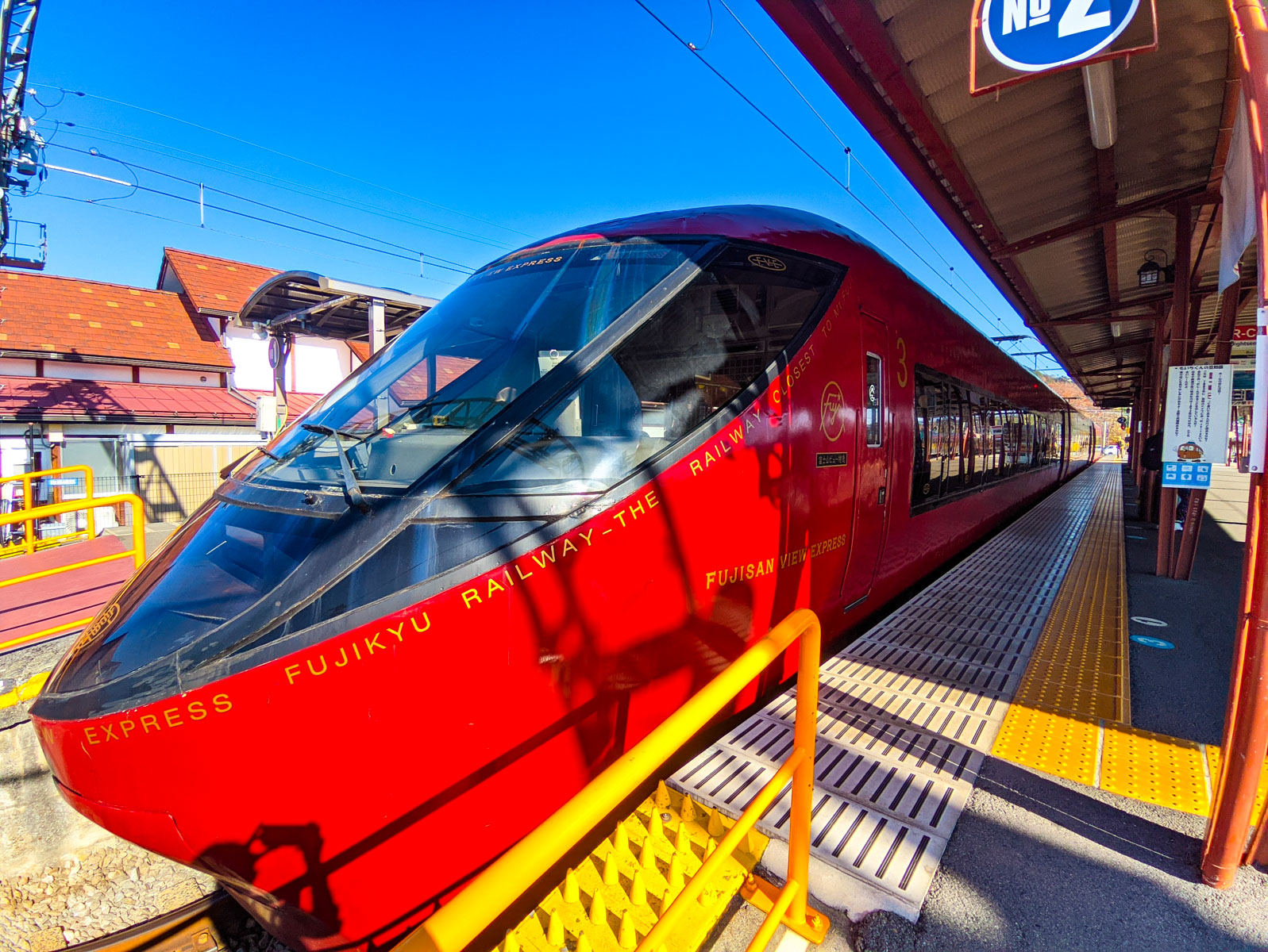 Bright red Fujisan View Express sightseeing train at Fuji Station, gateway to the iconic Chureito Pagoda, operated by Fujikyu Railway in Japan