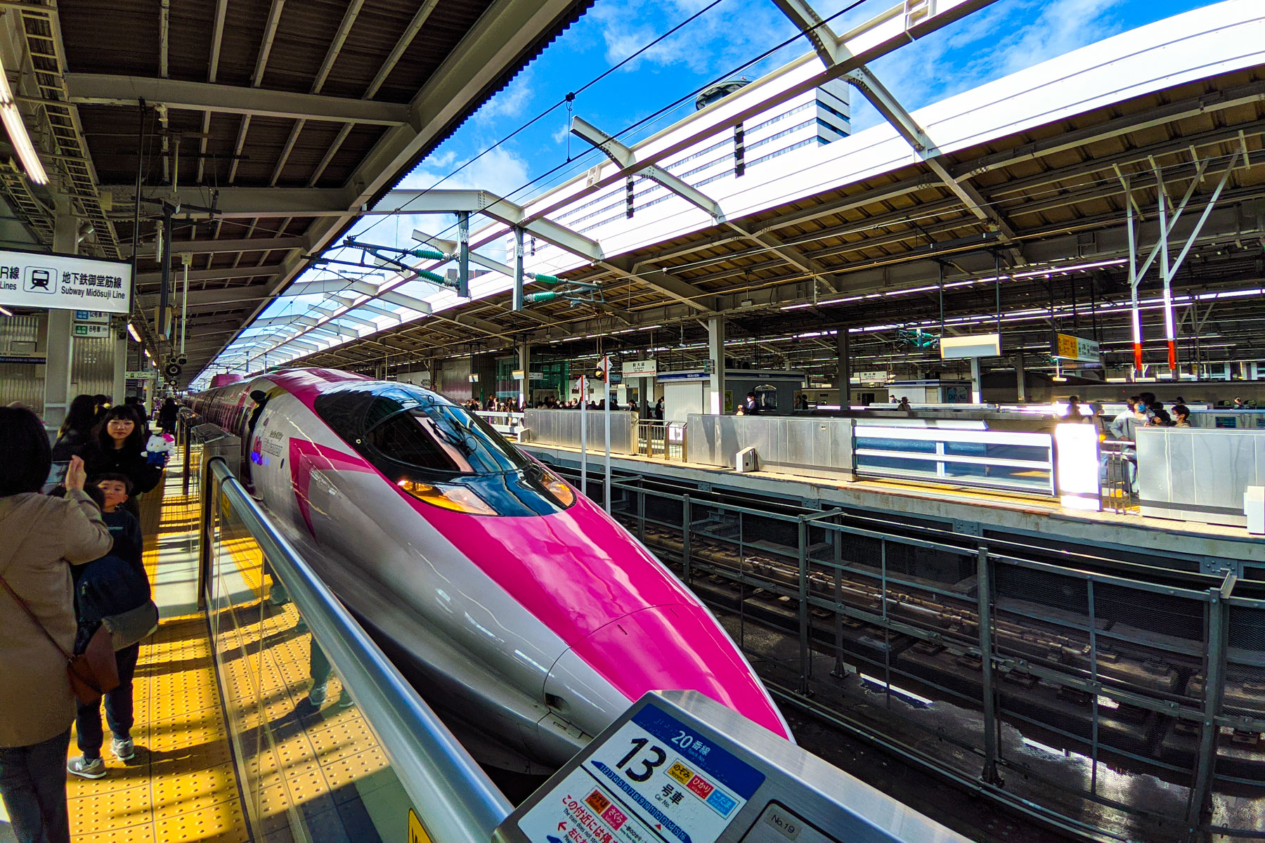 Pink and white Hello Kitty Shinkansen bullet train at the Shin-Osaka Station platform in Japan