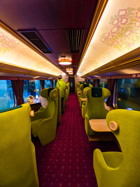 Inside the Kintetsu Aoniyoshi limited express, plush green seats, red carpet, decorated ceilings and elegant décor make the ride between Kyoto, Nara and Osaka feel like a luxurious journey through history.