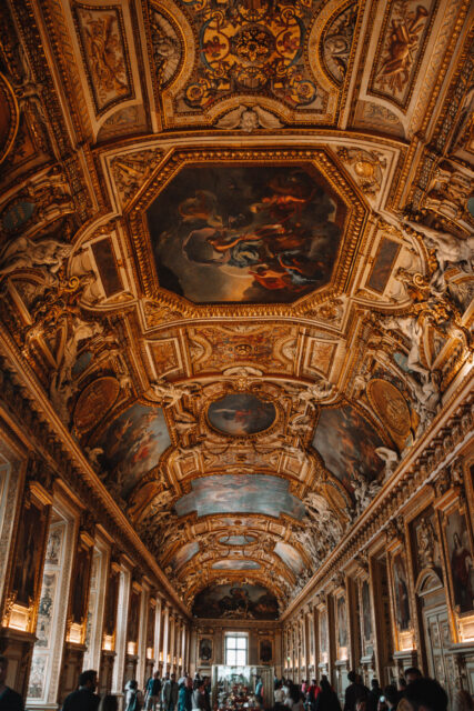 Gilded gallery with painted ceilings and sculptures in the Louvre Museum, Paris.
